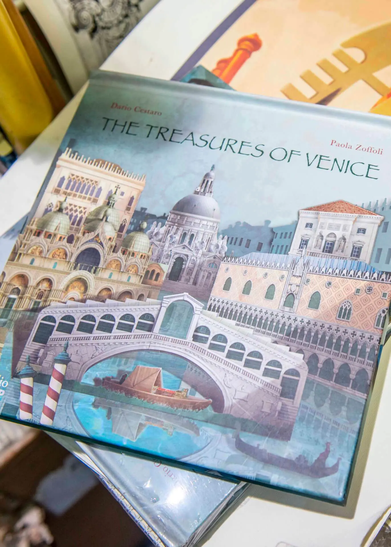 Books and Prints on a Shelf at a Famous Tourist Bookshop in Venice 