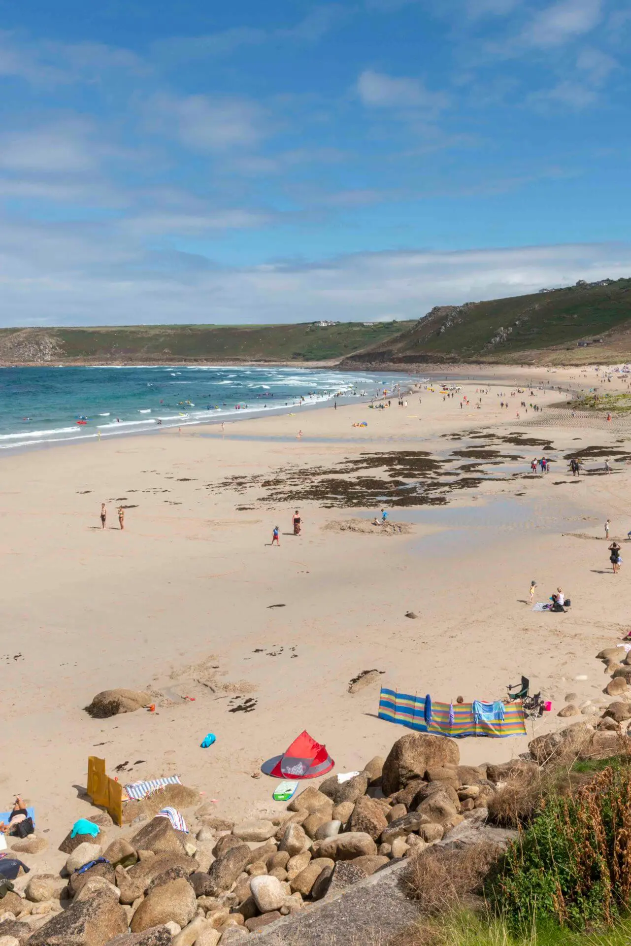 People Swimming at Sennen Cove Beach in Cornwall