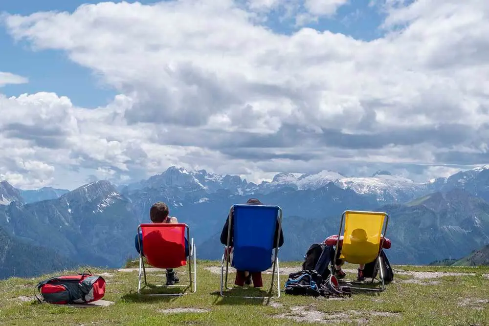People Sitting On Chairs At Dolomite Rifugio