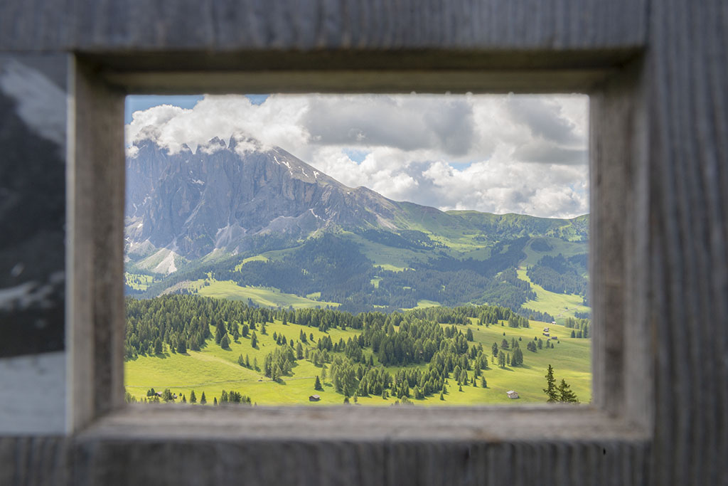 View of Dolomites through A Wood Window
